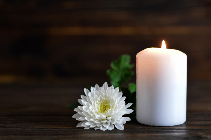 Candle and white Chrysanthemum flower